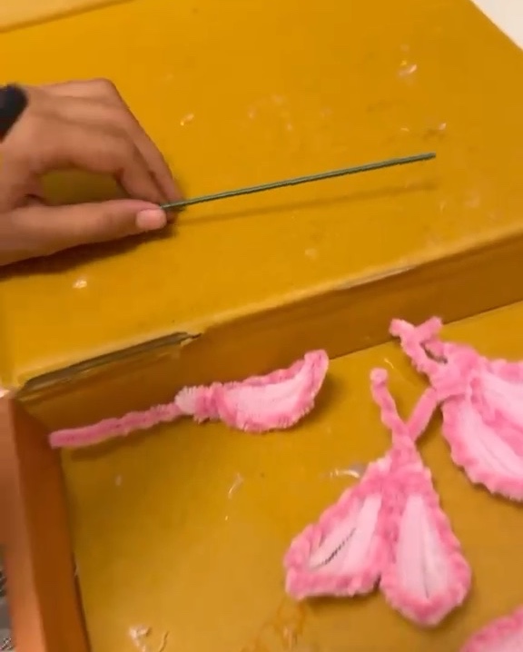 Pari shaping flower petals by hand in her craft workshop